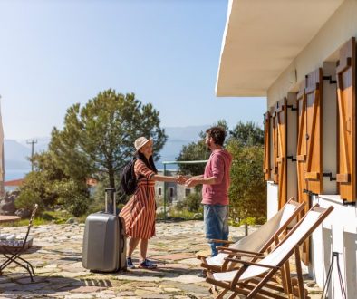 Host welcoming guest at house rental